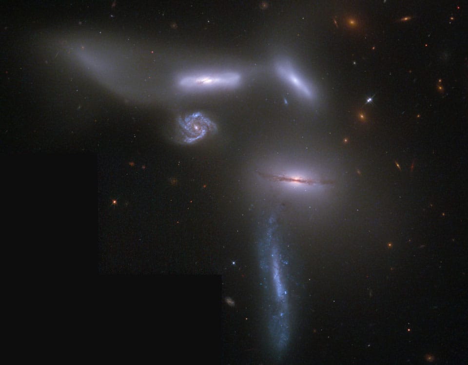 Strong Far-Infrared Cooling Lines, Peculiar CO Kinematics, and Possible Star-formation Suppression in Hickson Compact Group 57